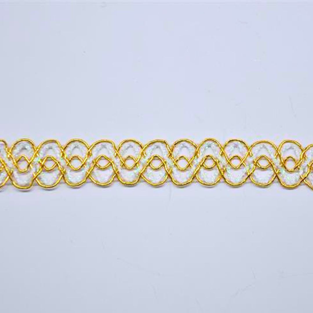 Decorative gold and white wave lace trim on a light background