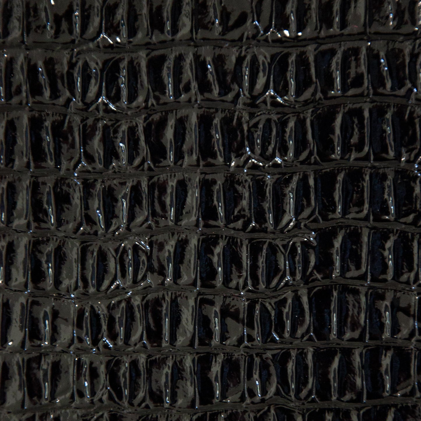 Faux crocodile vinyl in black for upholstery and crafts