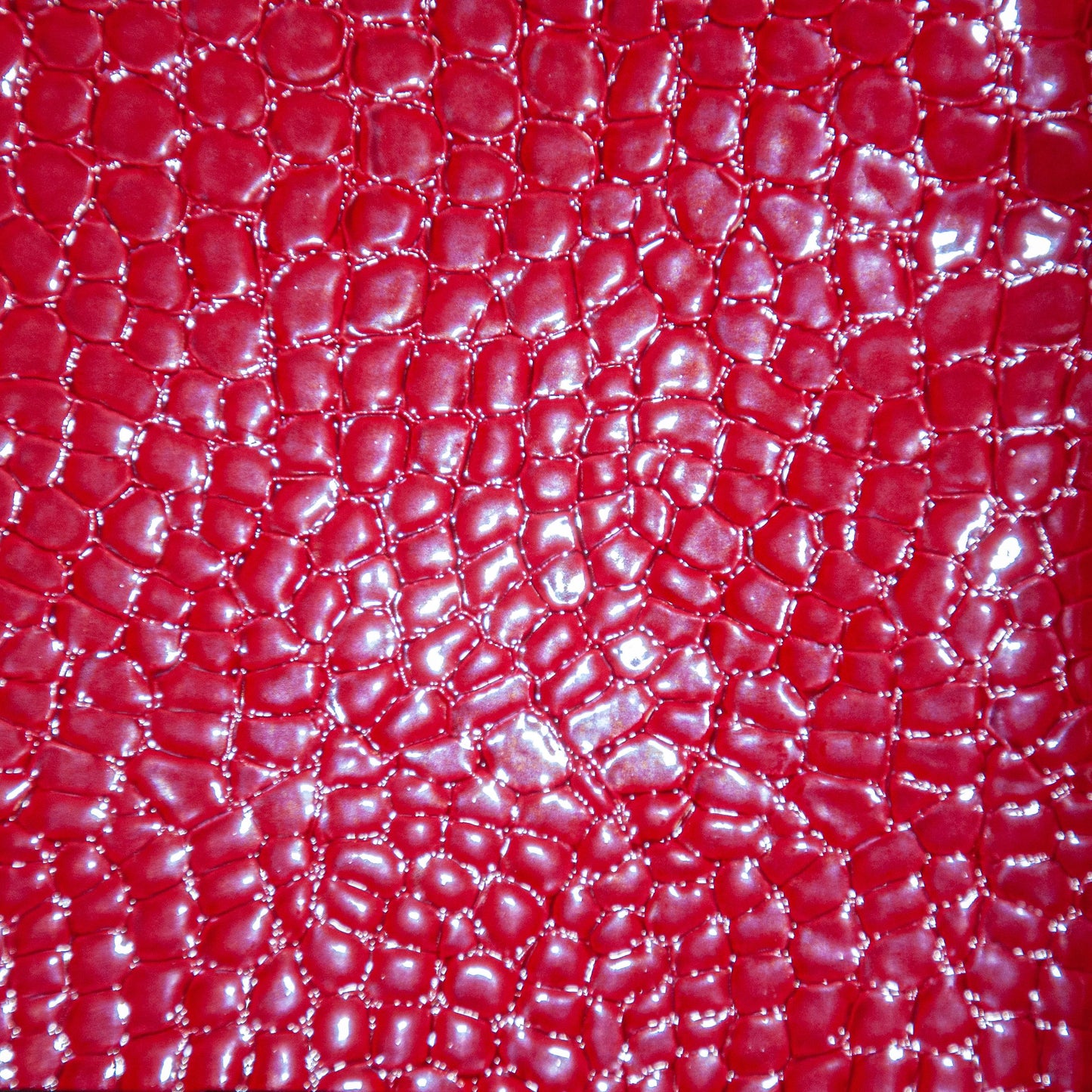 Faux snake vinyl in red for upholstery and crafts