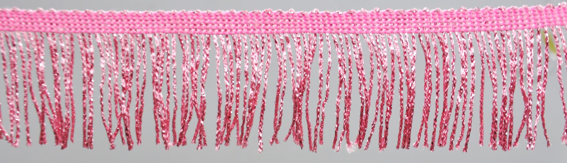 A 2-inch wide pink metallic chainette fringe trim.