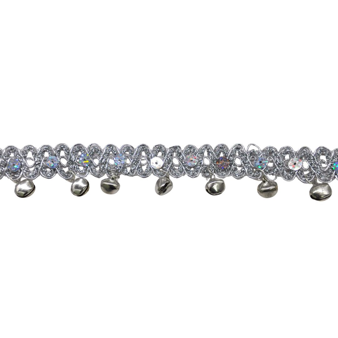 Decorative trim with sequins and small bells on a white background