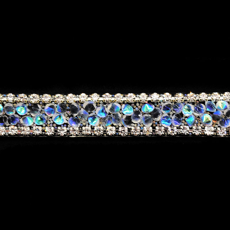 A close-up image of a beaded rhinestone trim with a shiny and glittery finish.
