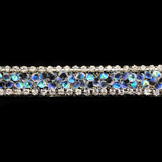 A close-up image of a beaded rhinestone trim with a shiny and glittery finish.