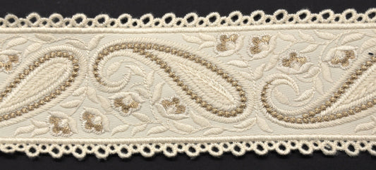 A close-up image of a beige decorative woven trim tape with a paisley pattern.