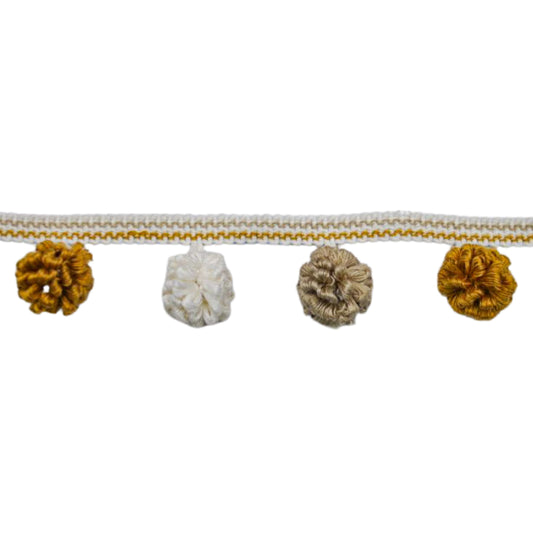 Decorative trim with pom-poms on a white background
