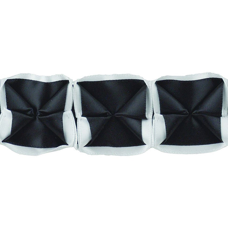 A series of box pleated ribbons in black and white, arranged in parallel against a white background.