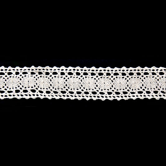 A roll of cotton cluny lace trim in ivory color with a oval pattern.