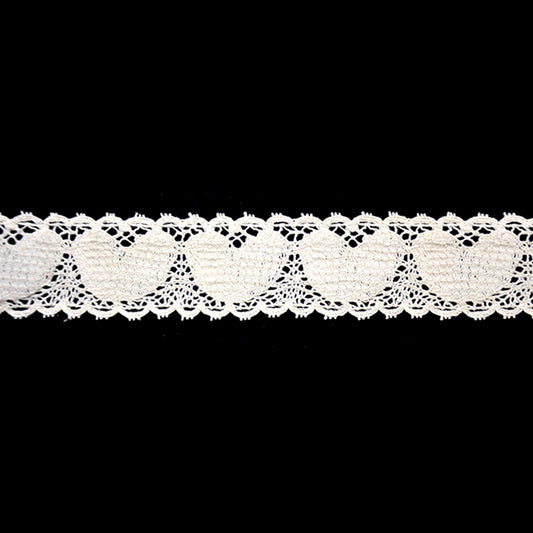 A 5-yard roll of ivory Cotton Cluny Lace with a hearts pattern, 1 1/2 inch in width, displayed against a black background.