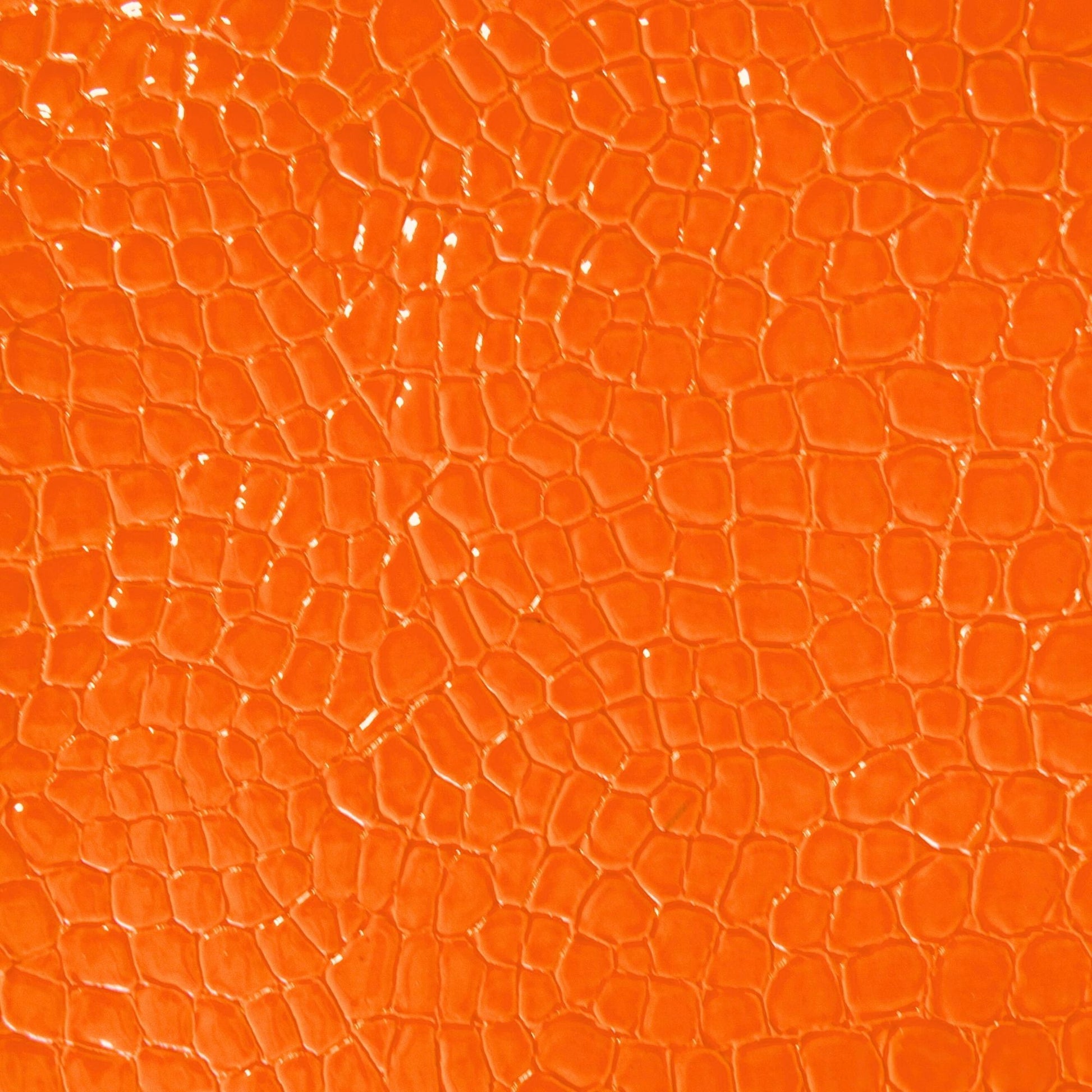 Faux snake vinyl in orange for upholstery and crafts