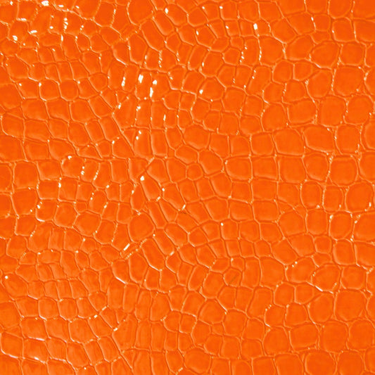Faux snake vinyl in orange for upholstery and crafts