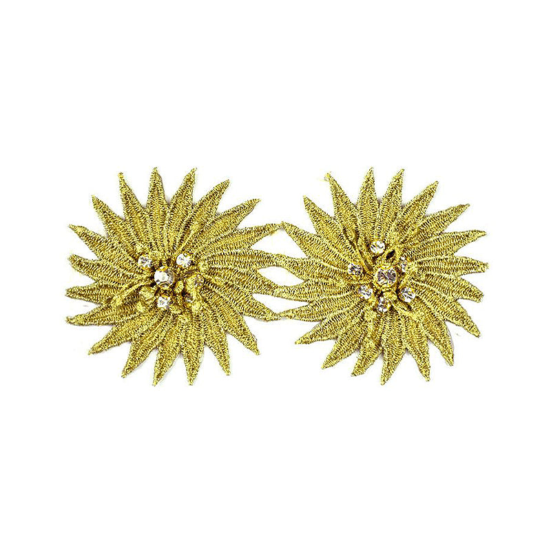 gold-colored flower-shaped trimmings with rhinestone centers