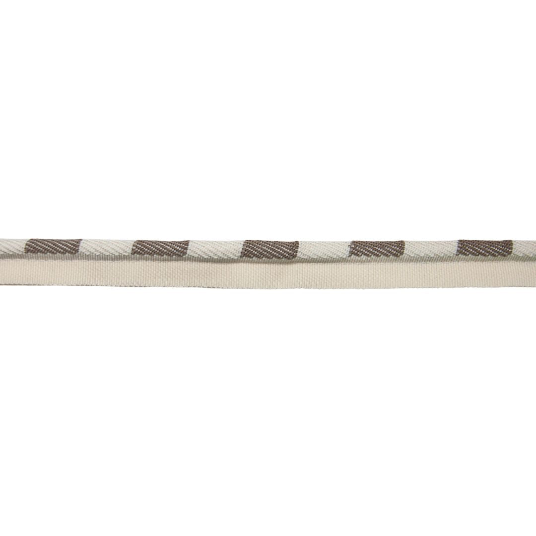 Close-up of a woven belt with gray plaid pattern on a white background