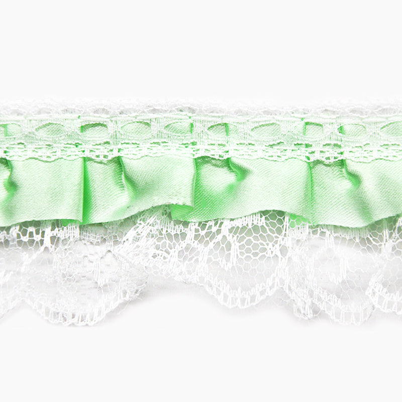A 2-inch wide mint green gathered lace with satin edge, shown in a rolled format, likely used for crafting or decorating purposes.