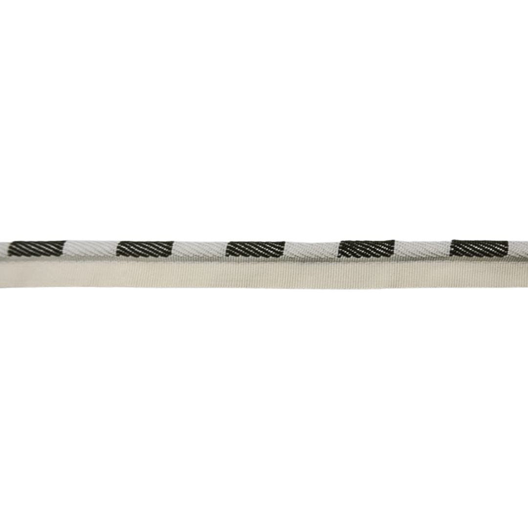 Close-up of a white rope with olive green and cream pattern on a white background
