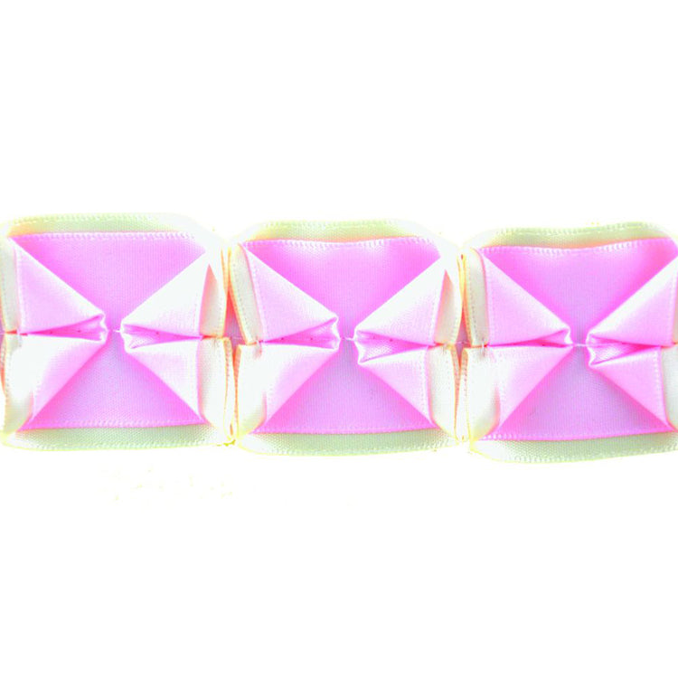 A series of box pleated ribbons in pink and beige colors, arranged in a line.