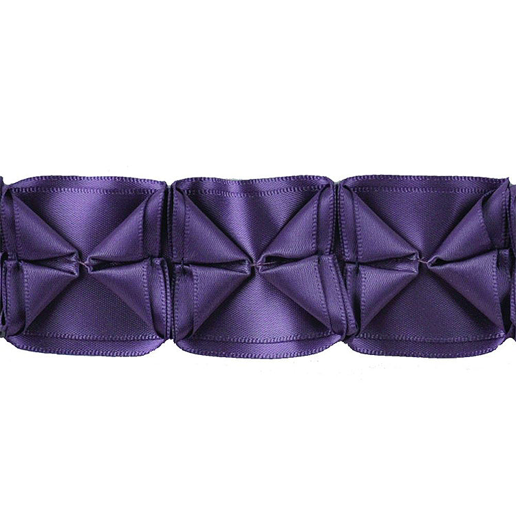 A 10-yard roll of box pleated ribbon in purple color.