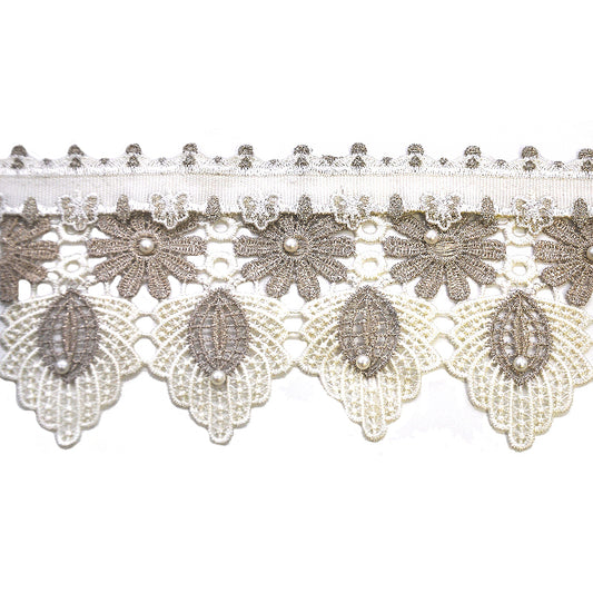 A roll of beige/grey lace trimming with metallic finish and pearls.