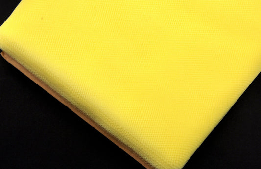 A bolt of yellow tulle fabric.